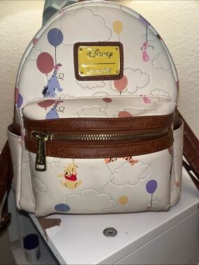 Loungefly Disney Cream Backpack with Multicolor Balloon Print